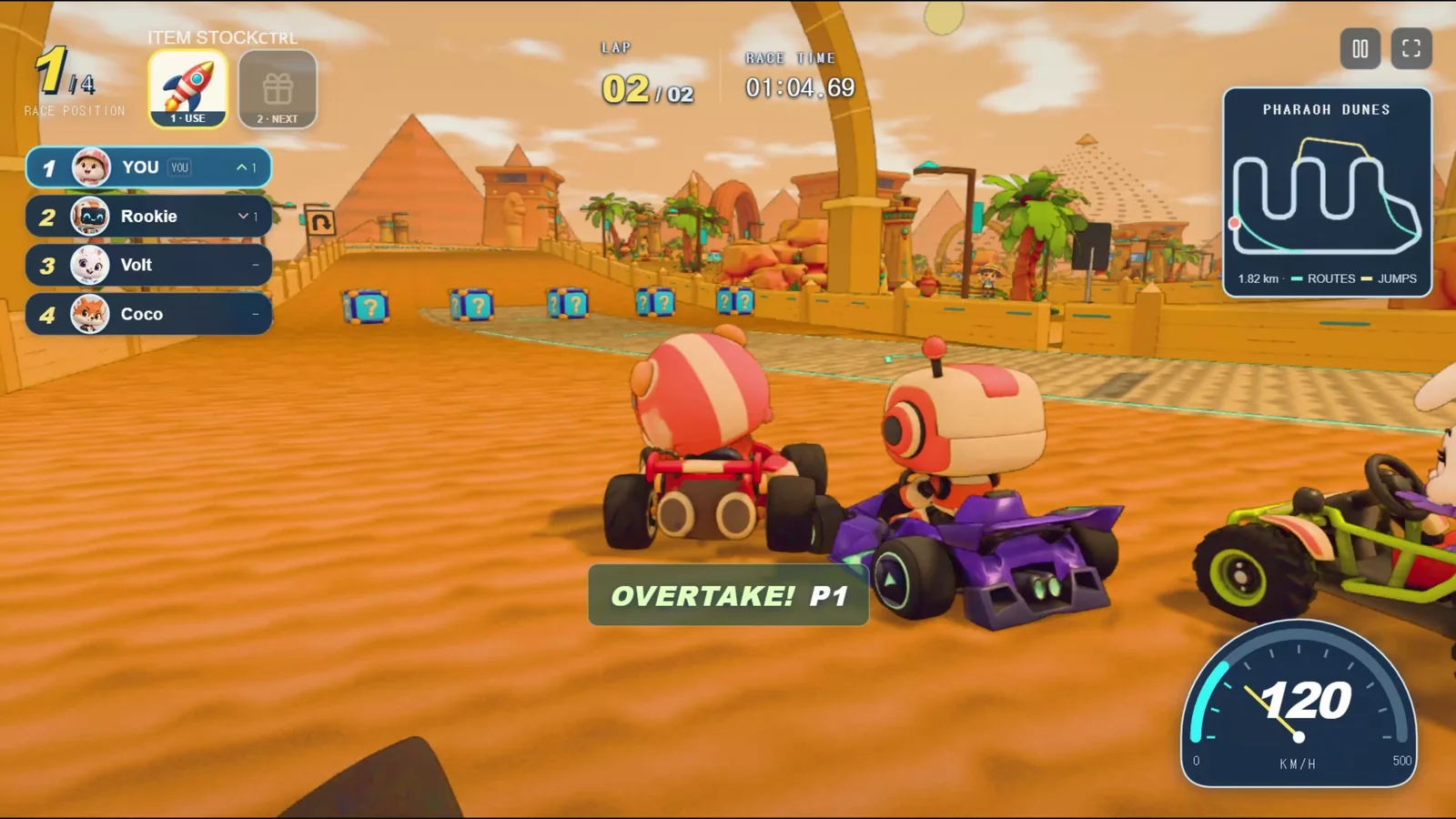 A KARTPOP race on Pharaoh Dunes: a driver taking first place, with the race order, item slots, minimap, and speedometer on screen